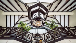 A traditional Japanese-style lantern with a geometric design, set within a wooden lattice structure. - Ocean front luxury villa iin gated golf course community with private beach. (Lowlands)