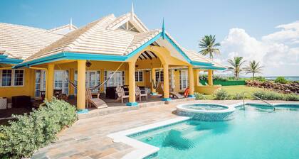 Ocean front luxury villa in gated golf course community with private beach.