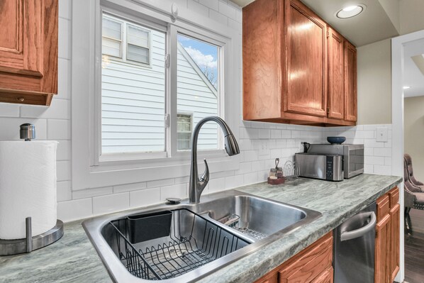 Fridge, microwave, oven, stovetop - The Charming Home: 3-bedroom house, blocks to downtown Champaign, with WiFi, AC (Champaign)