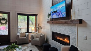 Smart TV, fireplace, table football, books