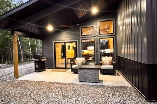 Covered private porch complete with sunset views, grill, fireplace and patio furniture.