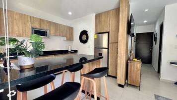 Fridge, microwave, stovetop, coffee/tea maker