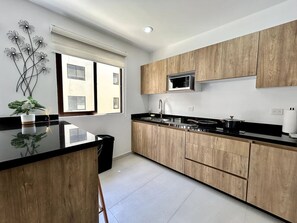 Fridge, microwave, stovetop, coffee/tea maker