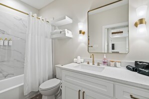 Hair dryer, towels, soap, shampoo