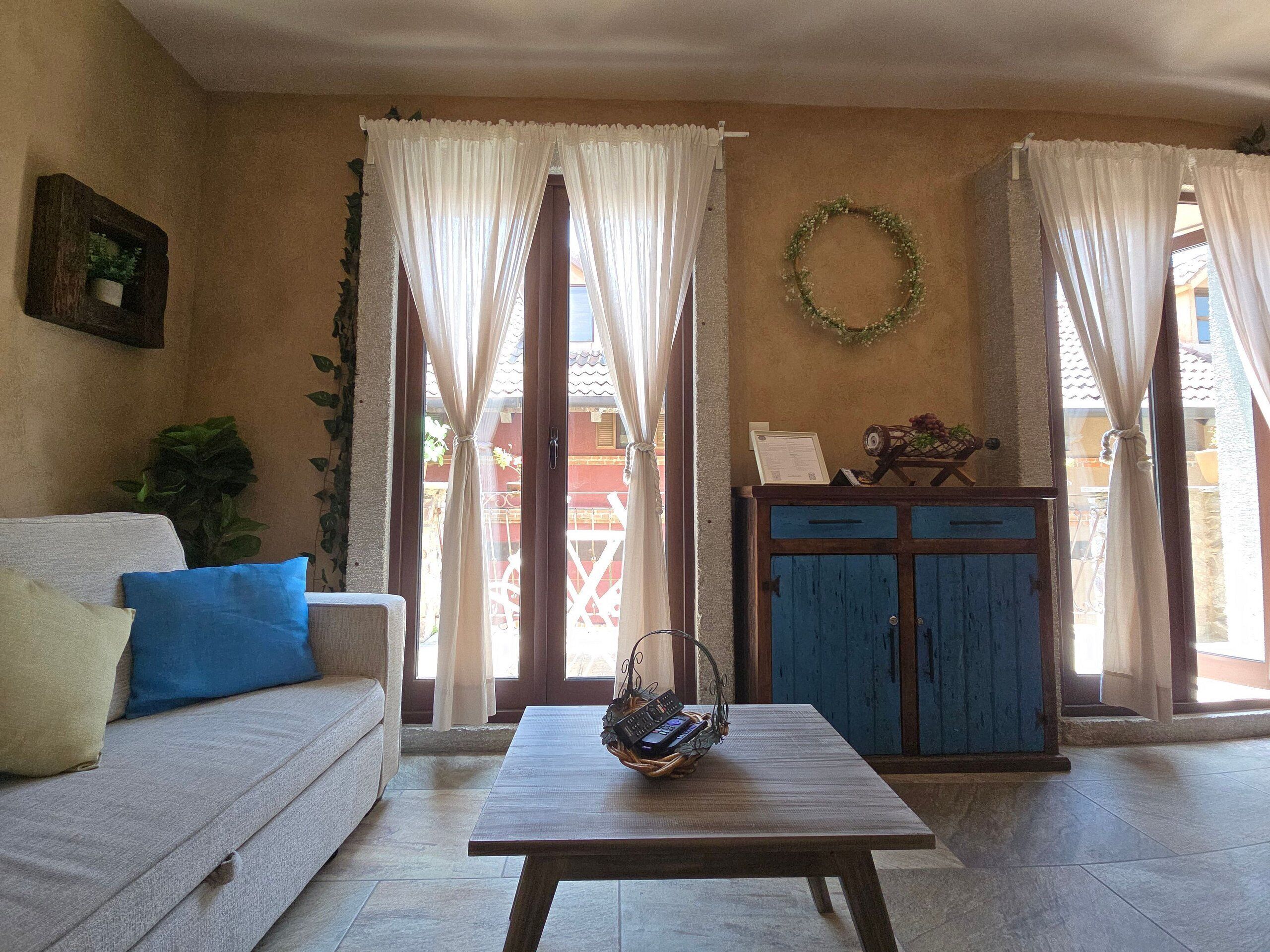 A living room with a sofa, a coffee table, and a cabinet.