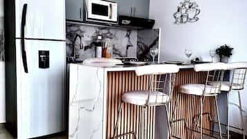 Fridge, microwave, stovetop, coffee/tea maker