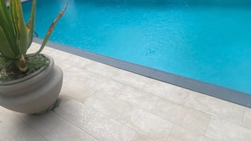 Outdoor pool, pool umbrellas, pool loungers