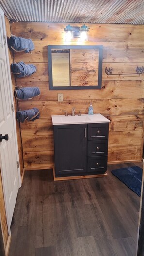 Shower, towels, soap, toilet paper