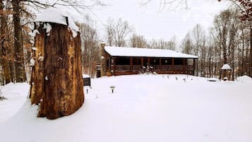 Cozy cabin nestled in a serene winter wonderland.