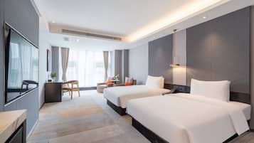Premium bedding, pillow-top beds, free minibar, desk