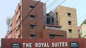 A building with a sign for "The Royal Suites" indicating a luxury boutique class hotel.