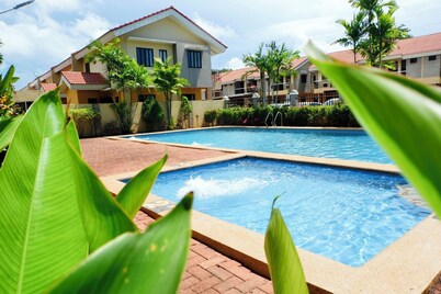 Boho Chic 2-bedroom House in Puerto Princesa with Pool Access and Workspace