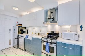 Fridge, stovetop, coffee/tea maker, cookware/dishes/utensils