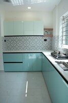Elite Apartment | Private kitchen | Fridge, stovetop, cookware/dishes/utensils