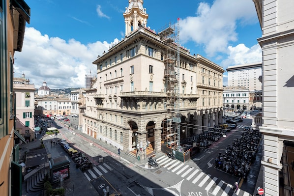 A historic building with classical architecture, including columns and a clock tower.