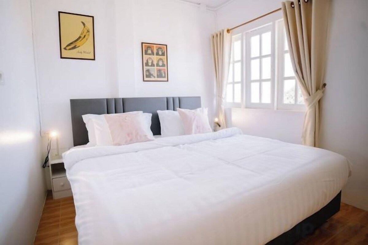 Minibar, desk, bed sheets