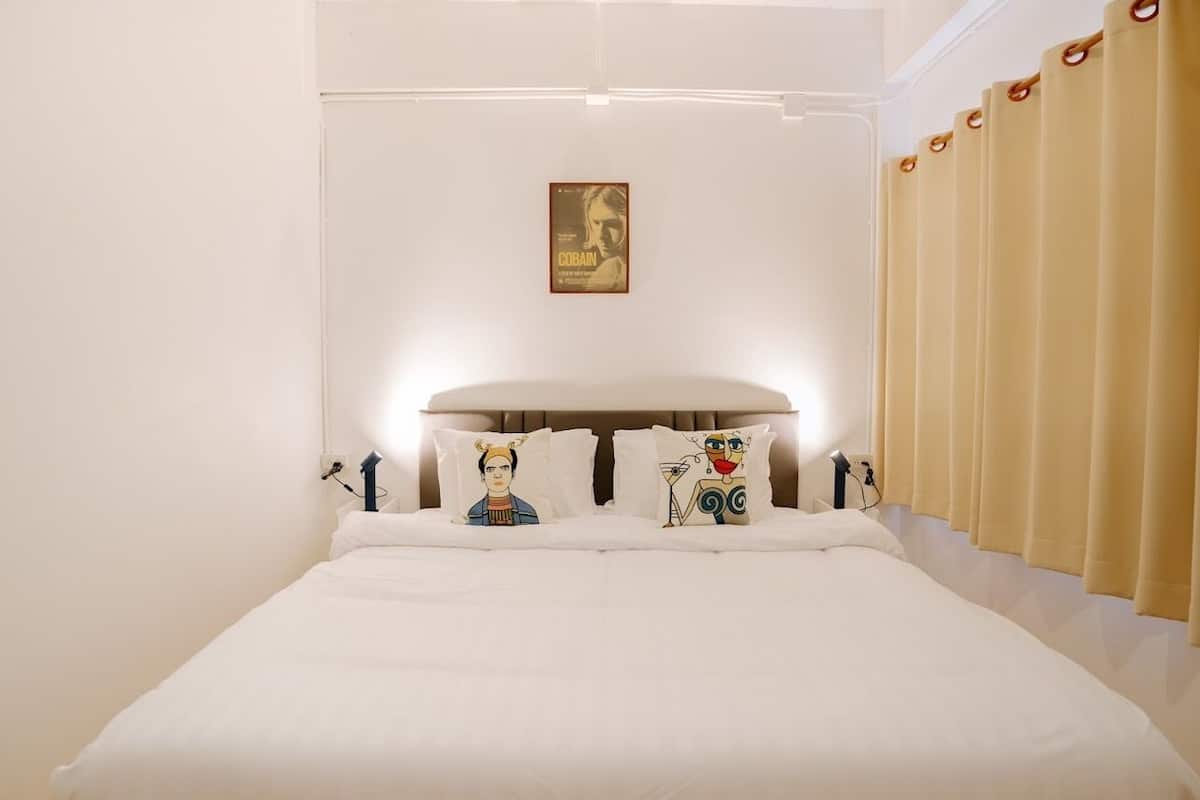 Minibar, desk, bed sheets