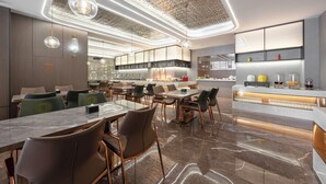 A modern restaurant with marble tables, green upholstered chairs, and a central bar area with a glass display. - World Hotel Hualian Shoppin Plaza branch (Kaifeng)