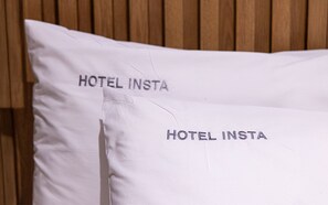 Two pillows with the text 'HOTEL INSTA' on them. - Hotel Insta Main Branch (Suwon)