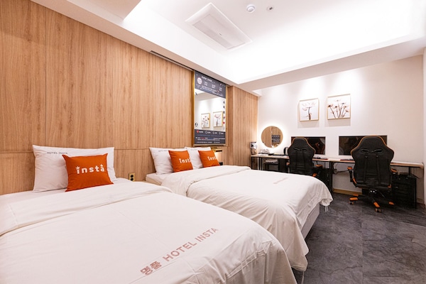 Premium bedding, down duvets, memory-foam beds, desk