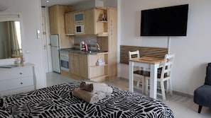Iron/ironing board, travel crib, free WiFi, bed sheets