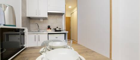 Fridge, microwave, stovetop, coffee/tea maker