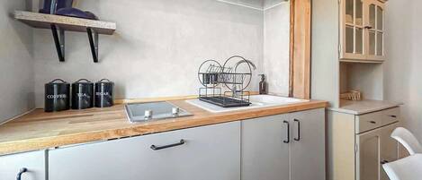 Fridge, microwave, stovetop, coffee/tea maker