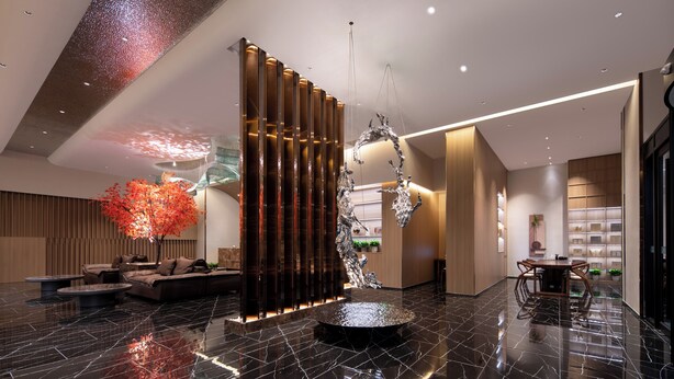 A modern lobby with a black marble floor, a central seating area with sofas and a round table, and a decorative tree with red leaves. - World Hotel Qingxian County Cangzhou (Cangzhou)