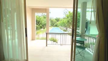 Deluxe Room, 1 Bedroom, Pool View | Terrace/patio