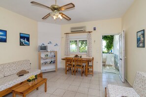 Apartment, 1 Bedroom, Sea View | Living area | Flat-screen TV - Crete Essence Villas-Makrygialos (Ierapetra)