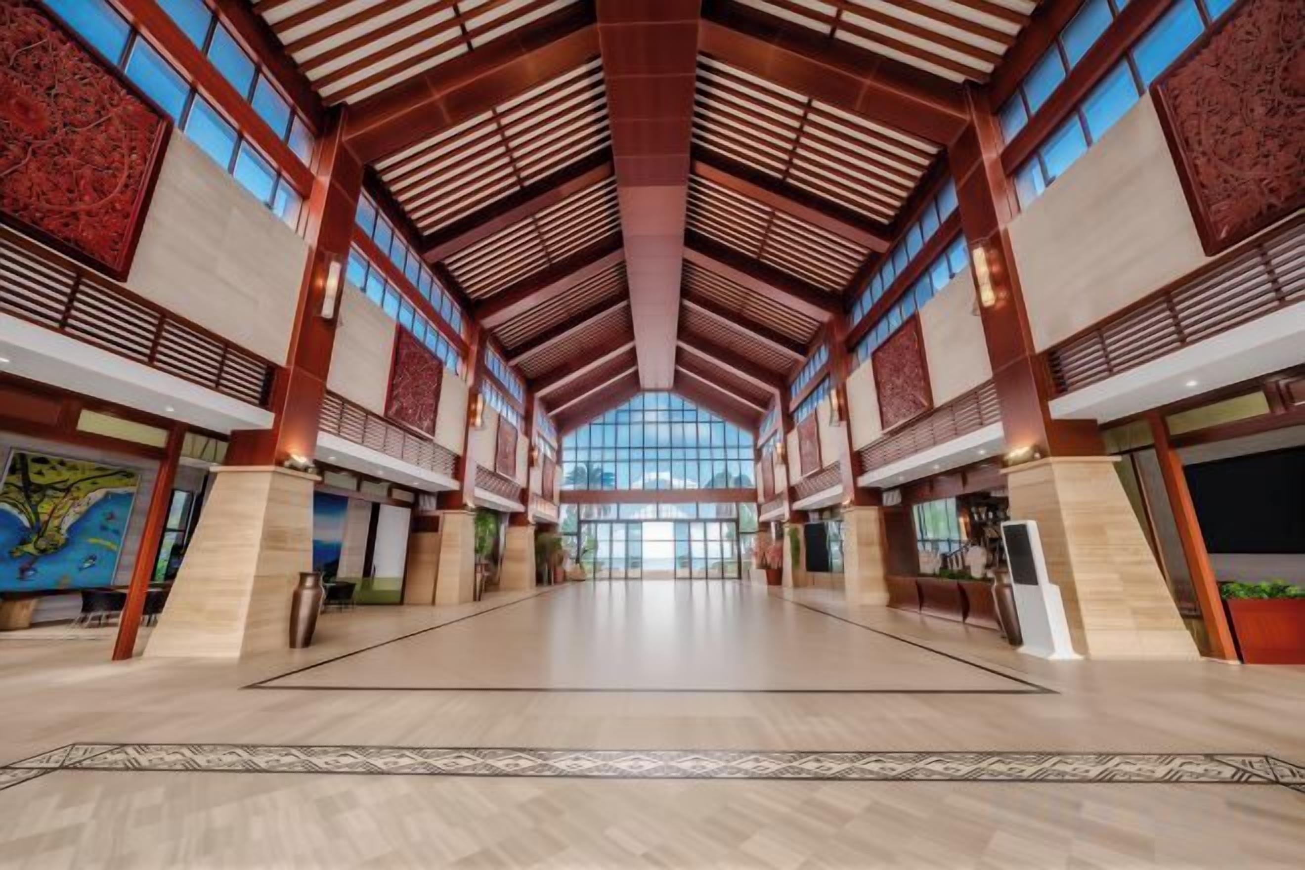 A spacious interior with high ceilings and large windows.