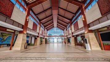 A spacious interior with high ceilings and large windows.