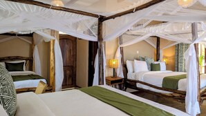 A room with two beds, each with a canopy bed frame and white bedding. There is a wooden door and a nightstand with a lamp. - Mvuli Mountain Lodge Ngorongoro (Karatu)