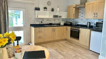 Comfort Apartment, Private Bathroom, Garden View | Private kitchen | Highchair