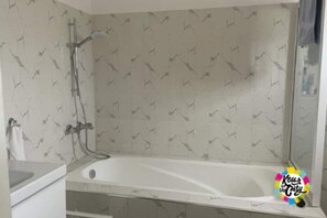 Shower, towels, soap, toilet paper