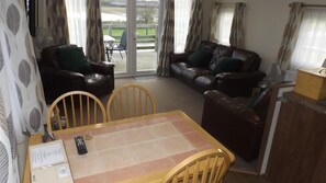 Living area - Modern 3 Bedroom Lodge at Avonvale Holiday Lodges (Evesham)
