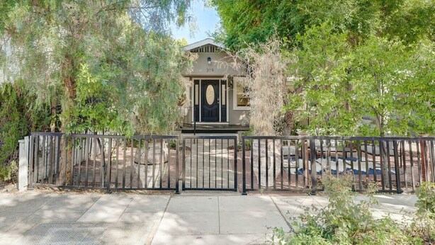 A gated entrance with a building featuring a number '319' above the door. - @ Marbella Lane -cozy 1BR Studio in Palo Alto Dwtn (Palo Alto)