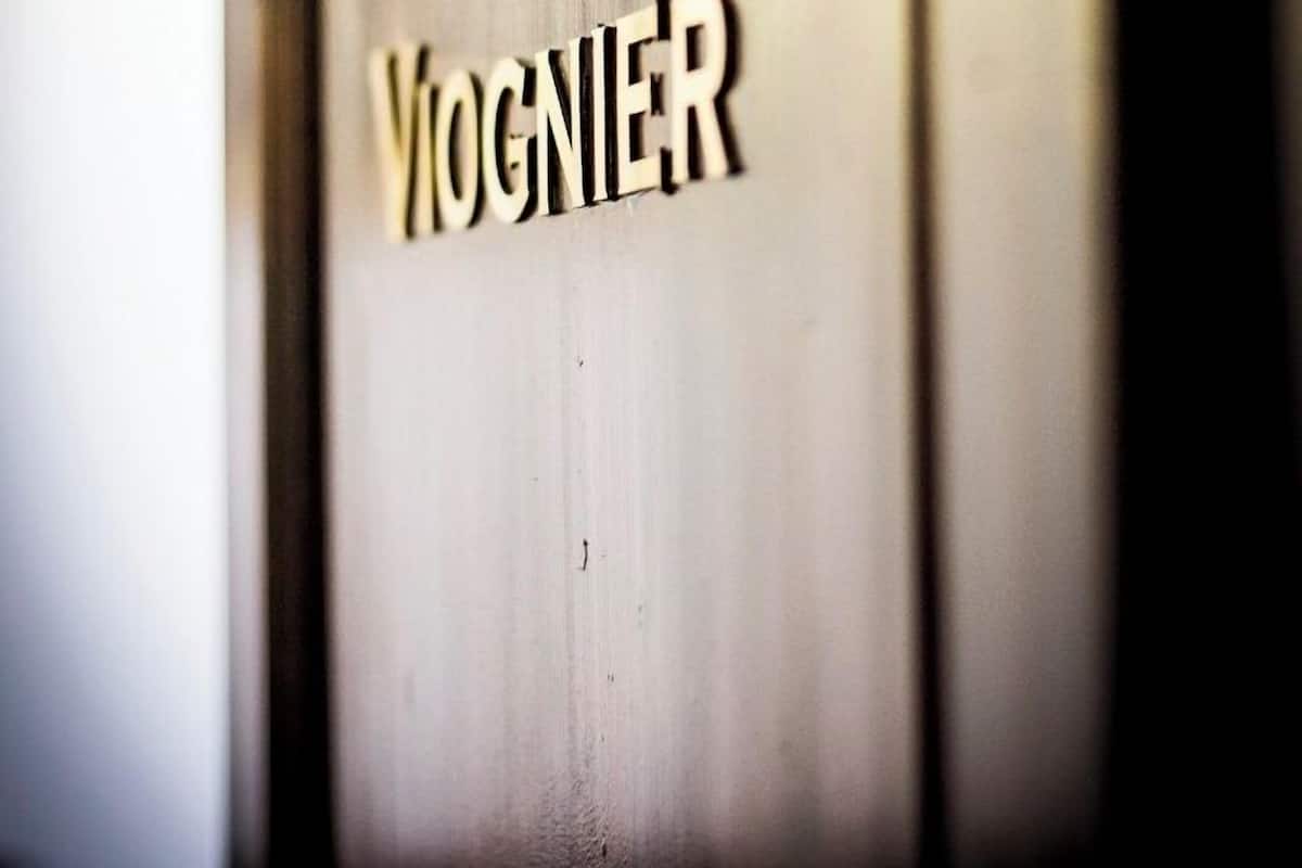 A close-up of a door with the name "VIGNIER" in bold letters.