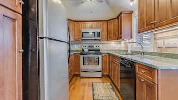 Cottage, Multiple Beds, Patio, Garden View (DELAWARE AVENUE 34B) | Private kitchen | Coffee/tea maker, dining tables
