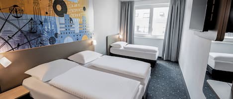 A hotel room with two beds, a large window, a wall-mounted TV, and a cityscape artwork.