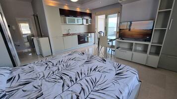 Superior Studio Suite, Balcony, Beach View | Iron/ironing board, free WiFi