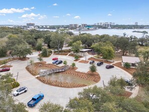 Guests can park their vehicles in the spacious parking area, with easy access to the building via a pedestrian pathway surrounded by lush greenery and scenic views.