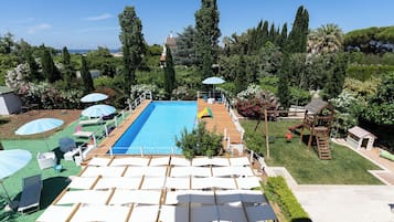 Seasonal outdoor pool, open 10:00 AM to 5:00 PM, pool umbrellas