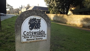 A sign for Cotswolds, an area of outstanding natural beauty. - Two Bedroom Timber Lodge, Avonvale Holiday Lodges (Evesham)