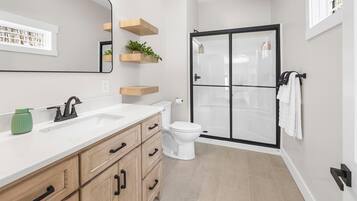 Shower, hair dryer, towels, soap