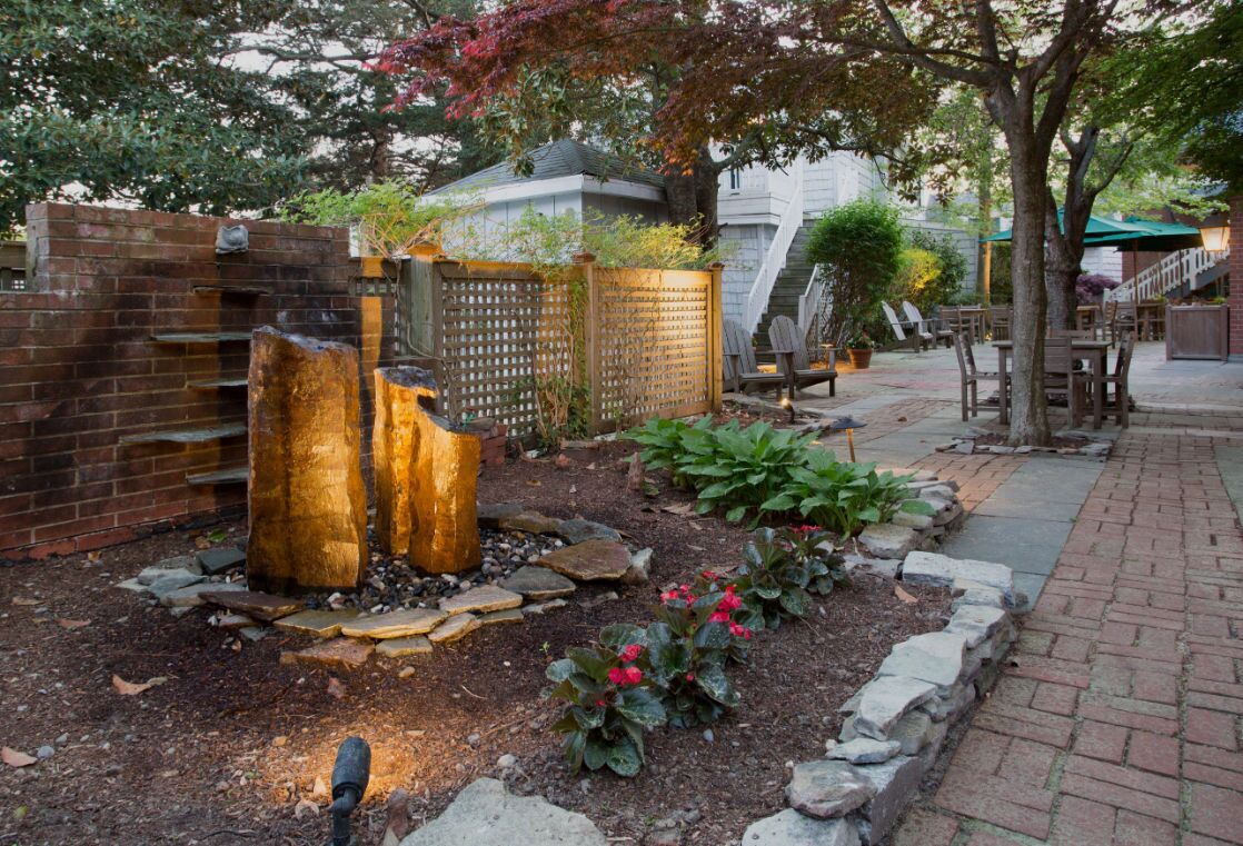 Charming garden pathways lead to hidden corners of serenity, complete with soothing water features.