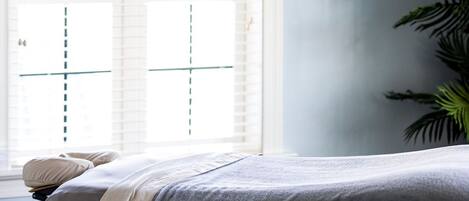 Serenity meets comfort in this tranquil treatment room, where peaceful moments await.