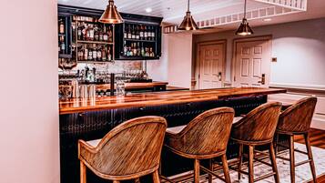 Stylish bar seating and warm lighting set the stage for an intimate evening of fine drinks and conversation.