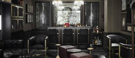 A bar area with leather seating, a bar counter, and decorative lighting.
