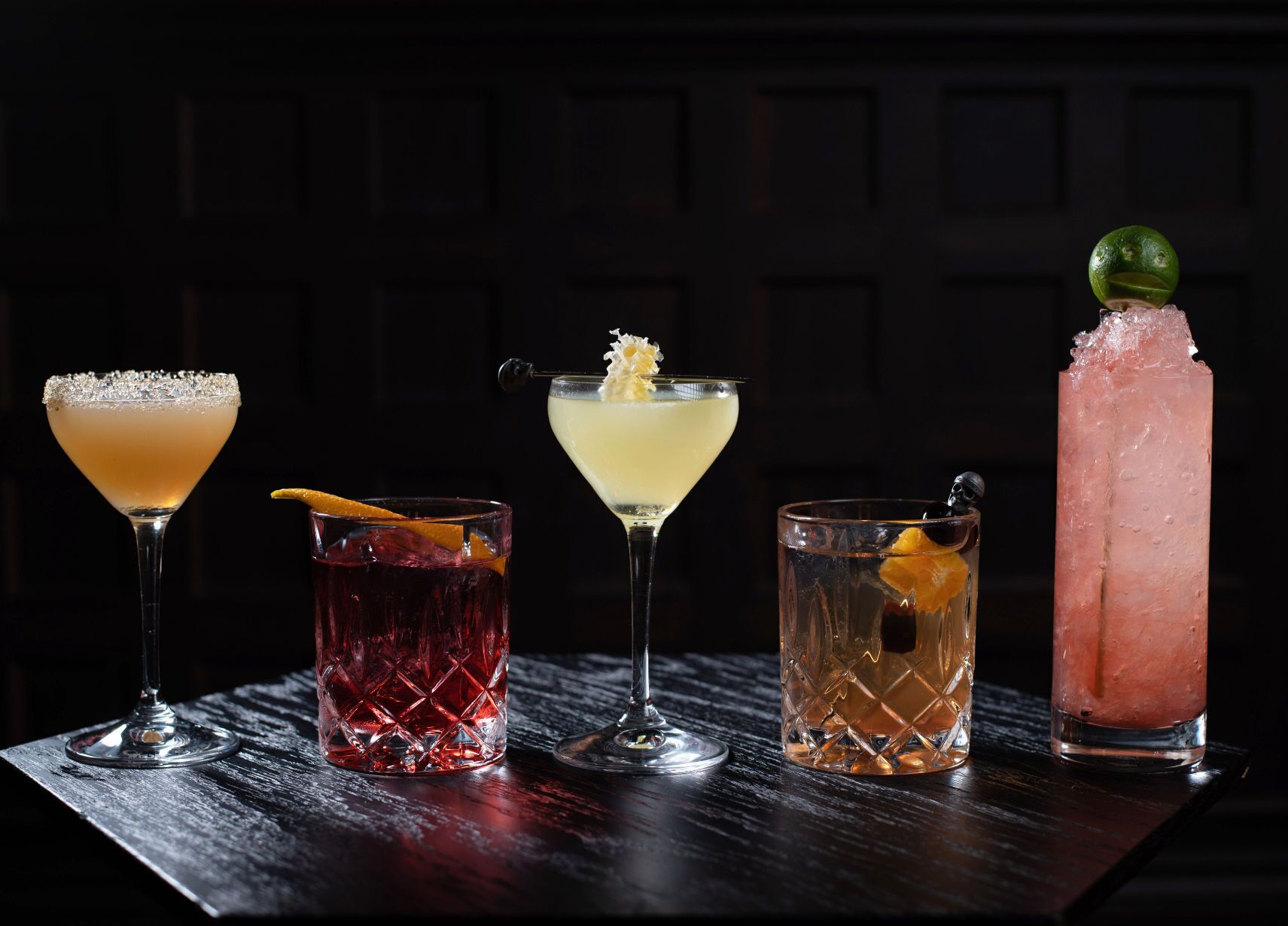 Signature cocktails, expertly crafted, blending bold flavors and artistic presentation for a memorable sip.
